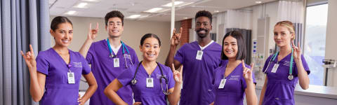 GCU Arizona ABSN students holding lopes up in a hospital setting