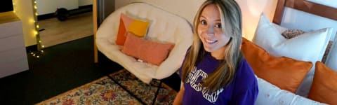 Student in her decorated dorm room