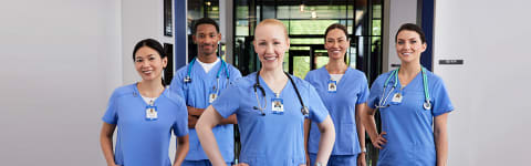 ABSN degree graduates smiling in hospital