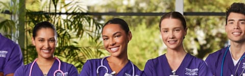 Group of nursing students smile in hospital