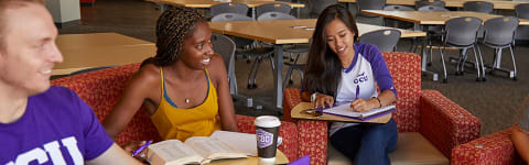 Diverse group of students talking in common area