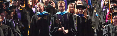 praying at a GCU graduation