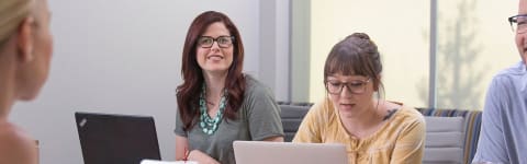 student and her professors doing research