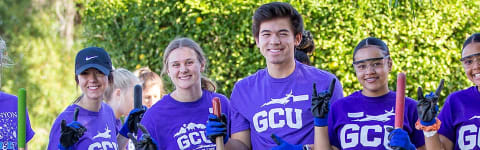 five GCU students at a serve the city event