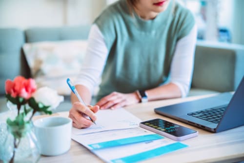 Young female managing expenses 