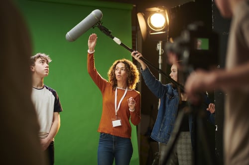 Film students in front of a green screen