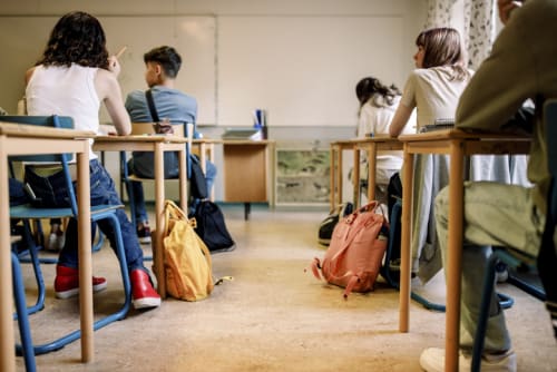 High school students sitting at their desks in a classroom