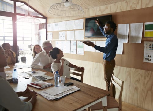 A group of people in a business meeting