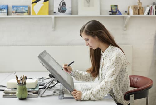 a graphic designer working in her home office