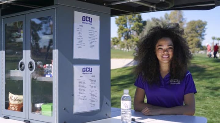 students working on GCU golf course beverage cart