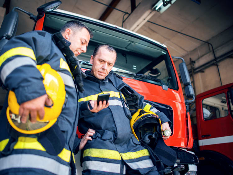 Firefighters talking to each other