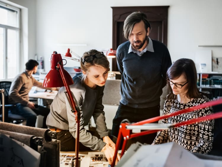 graphic designers discussing a project