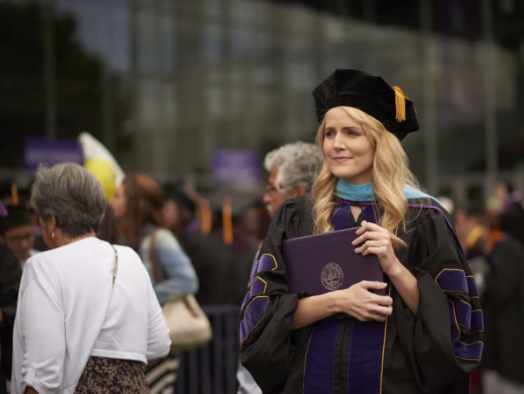 GCU doctoral student with her PhD degree