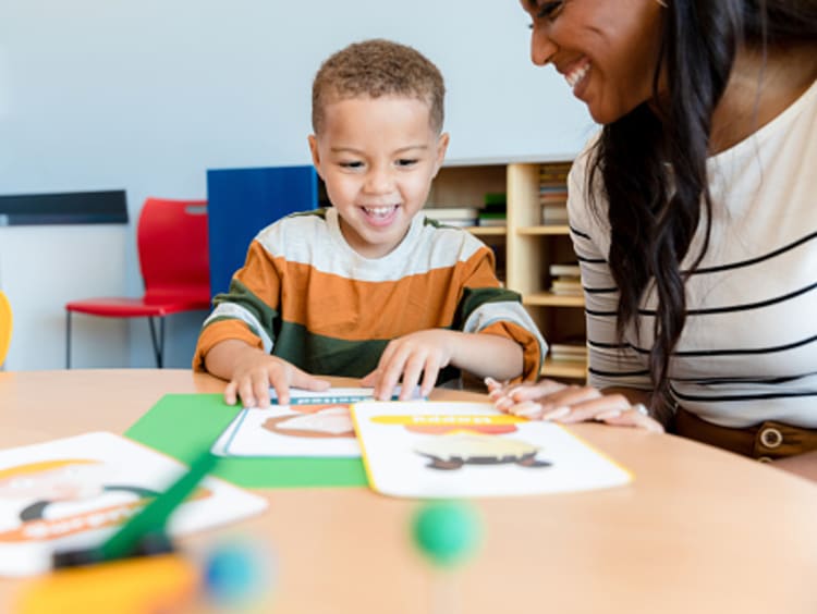 A developmental psychologist talking to a little boy