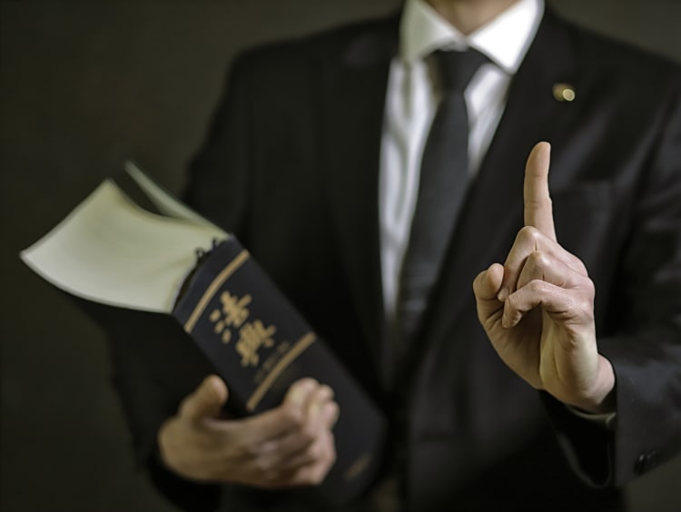 lawyer holding law book