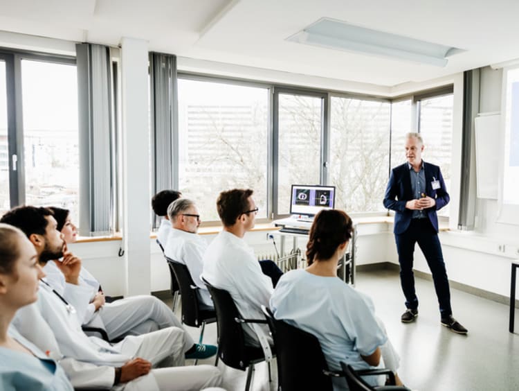 healthcare administrator giving a presentation