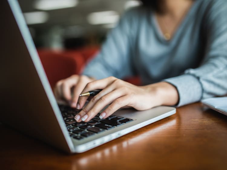 Student on laptop using AI tools