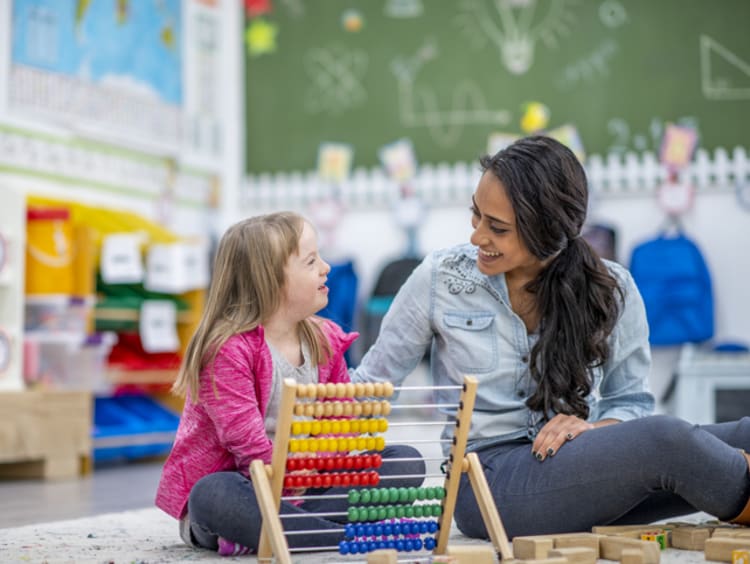 Teacher helping student with special needs