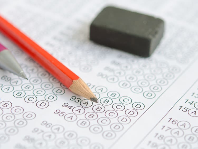 paper test with two pencils and an eraser on top of it