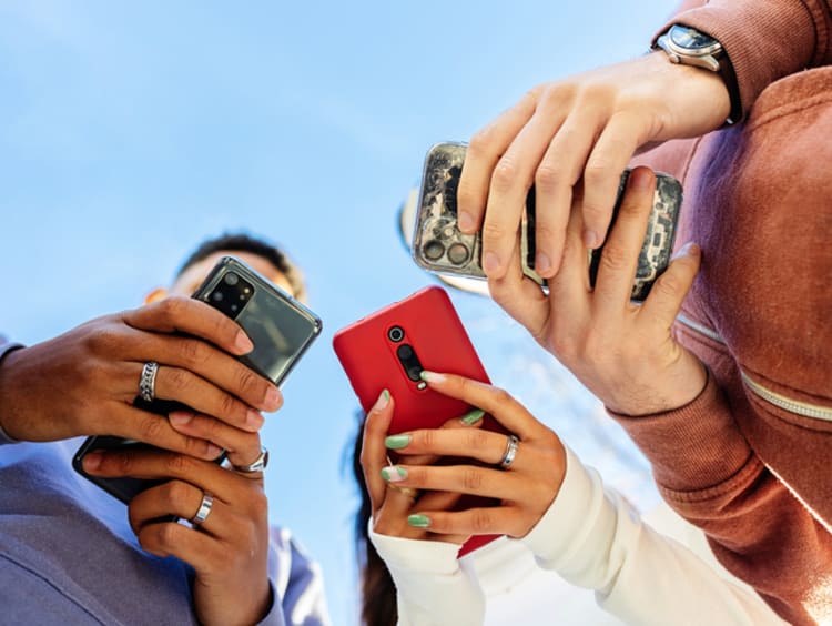 Teenagers interacting with phones