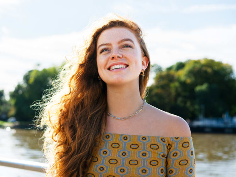 Young woman outside enjoying spring
