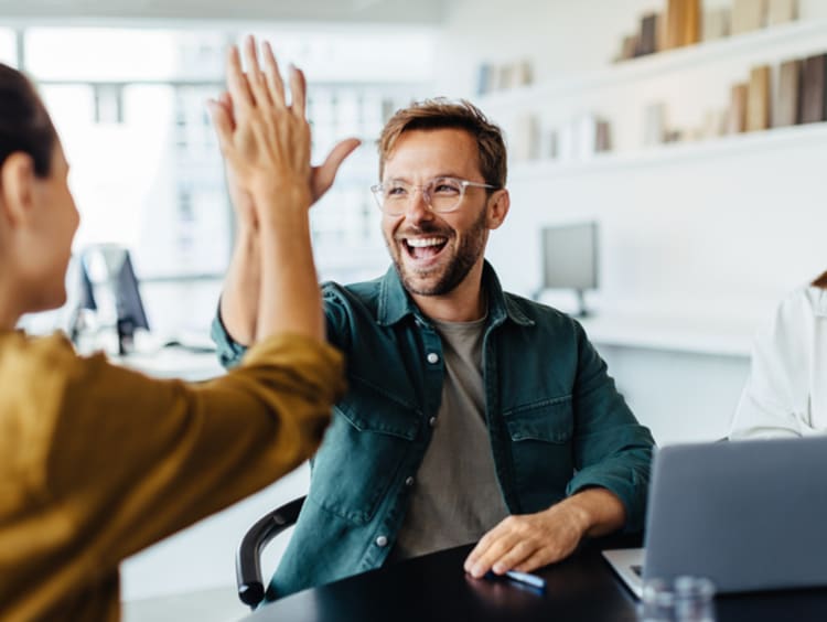 Business people celebrating in an office