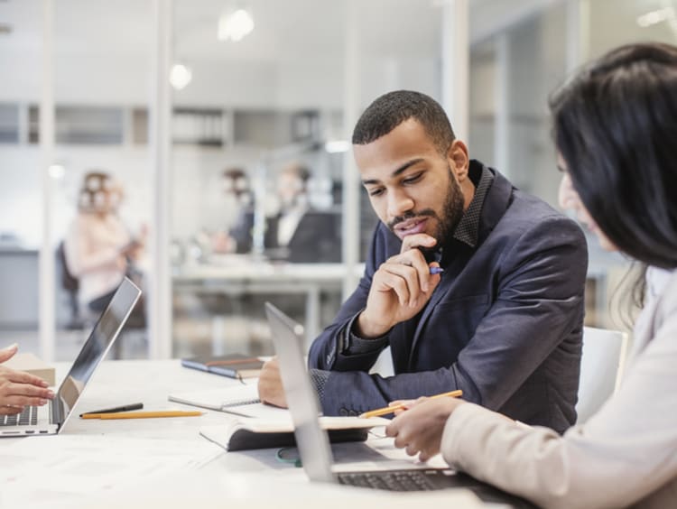 Business people having a meeting and going over documents