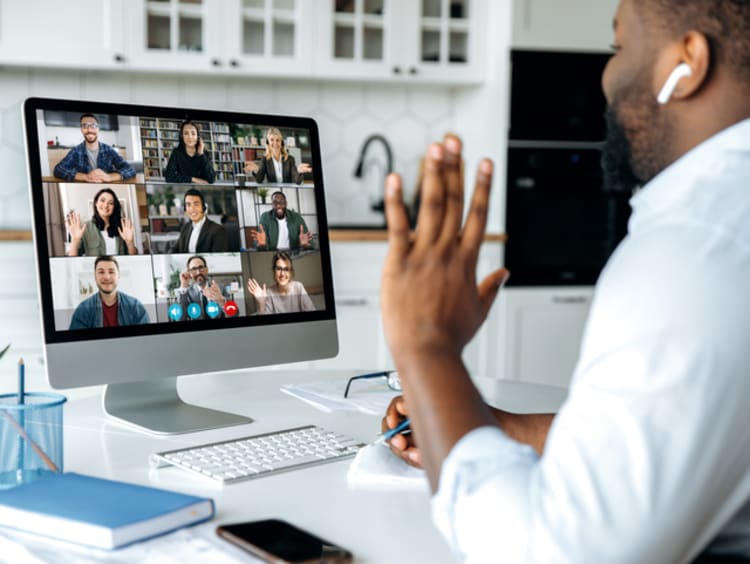 Man having a video call on a computer.