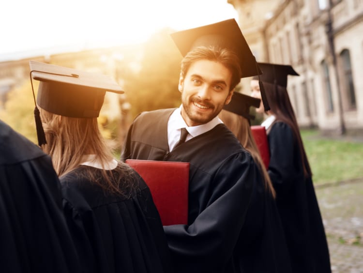 Graduates earning their PhD