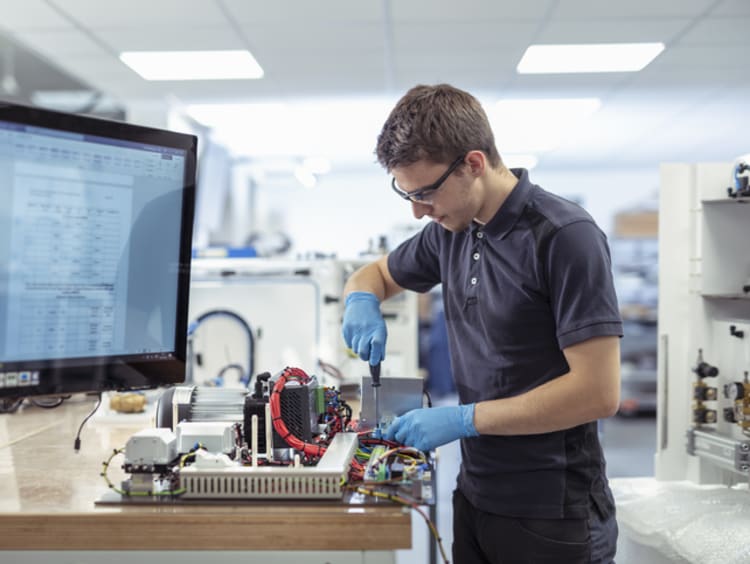 Engineering working on circuit board