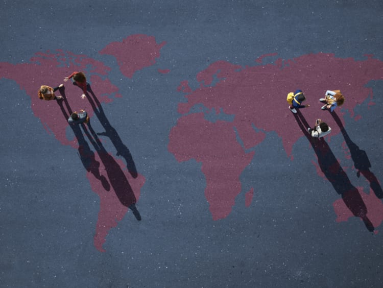 Two small groups of people, having discussion. Standing on world map, painted on asphalt - stock photo