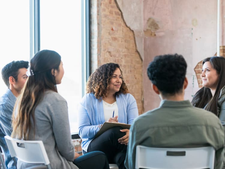 Sociologist leading a group discussion