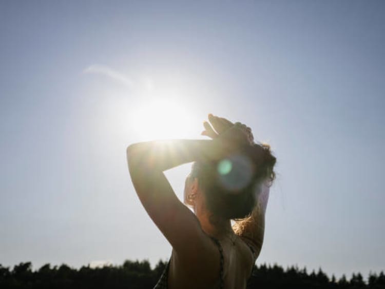 Girl watching the sun.