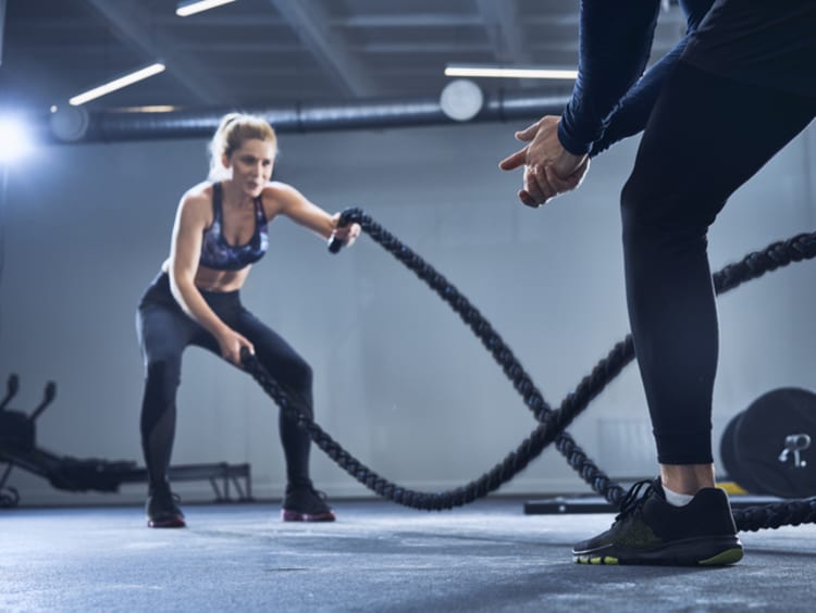 athletic trainer working with ropes