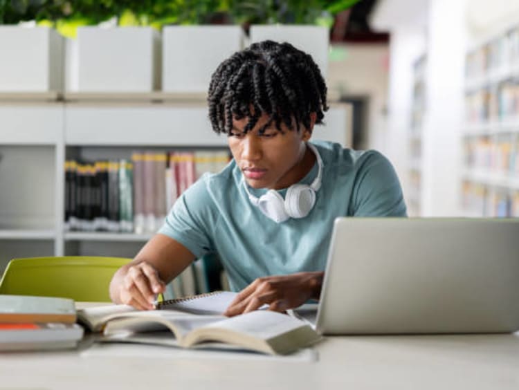 Student studying for his dissertation.
