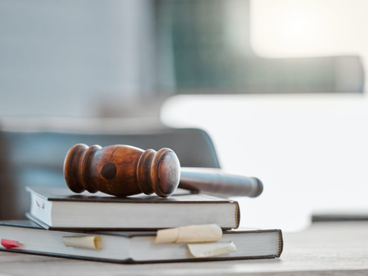 gavel on desk with papers
