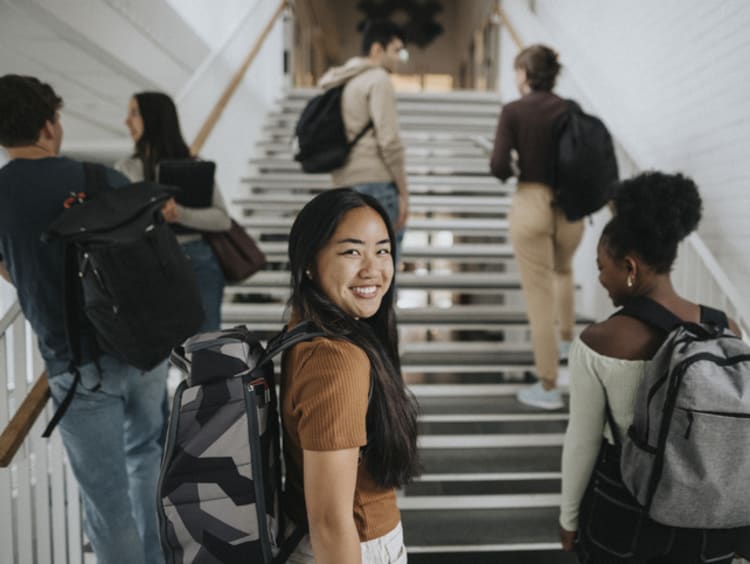 Woman with backpack ready to learn business values