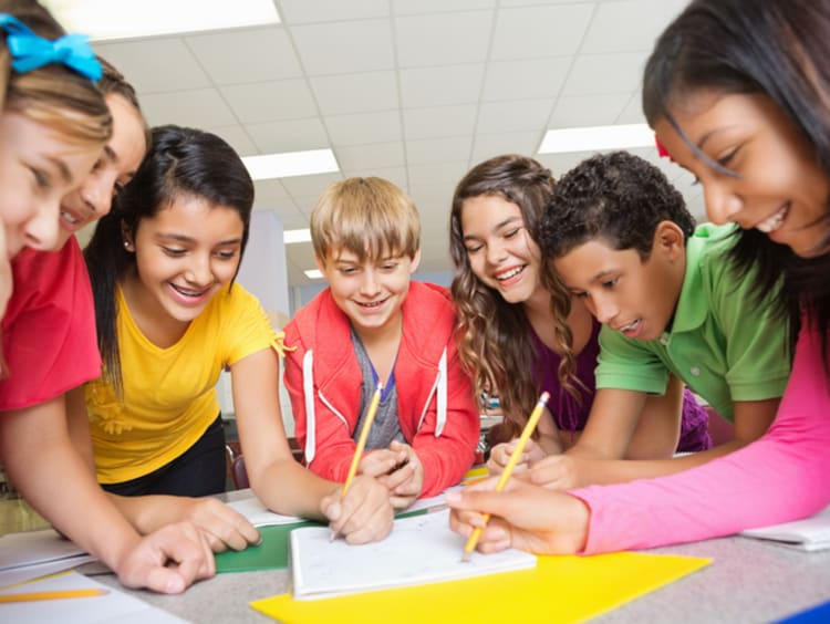 young group of students working on a project together