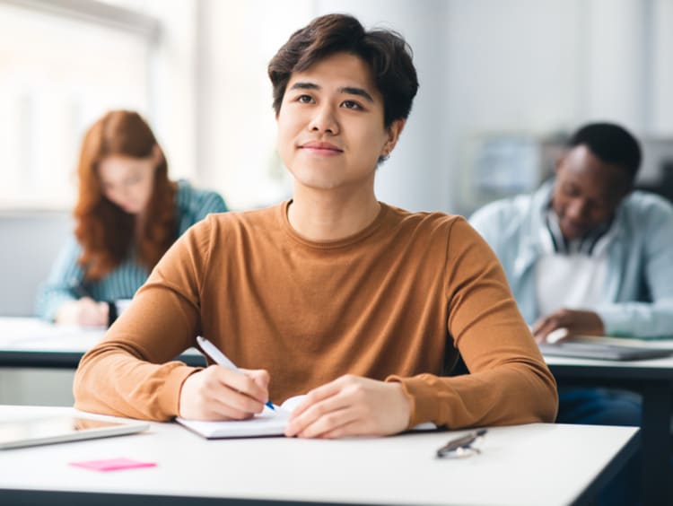 Student contemplates his studies.