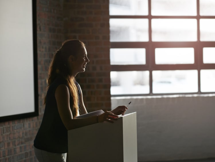 Businesswoman doing a talk at convetion - stock photo
