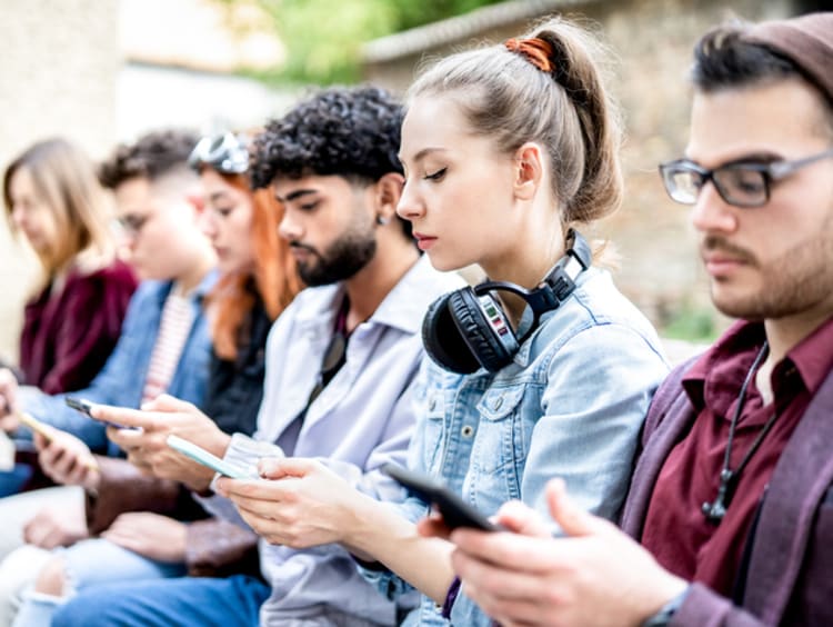 College students on their phones.