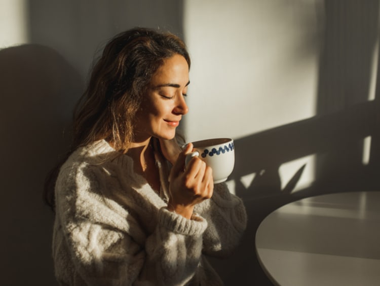 Woman enjoying her coffee.