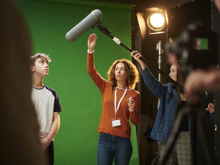 Film students in front of a green screen