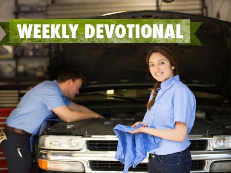 people working on a car
