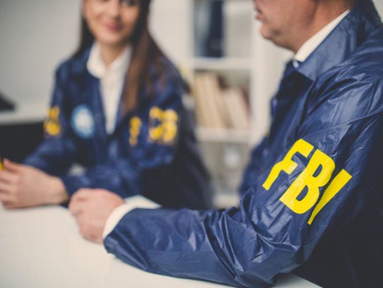 FBI agents sitting together at a table