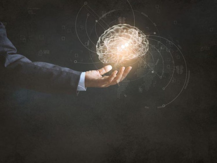 Professional man holds glowing orb of intellectual principles
