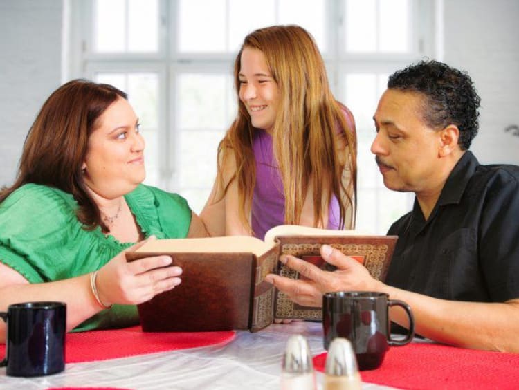 family reading a book