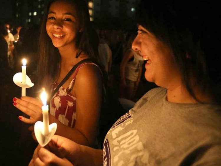 Two girls with candles in hand