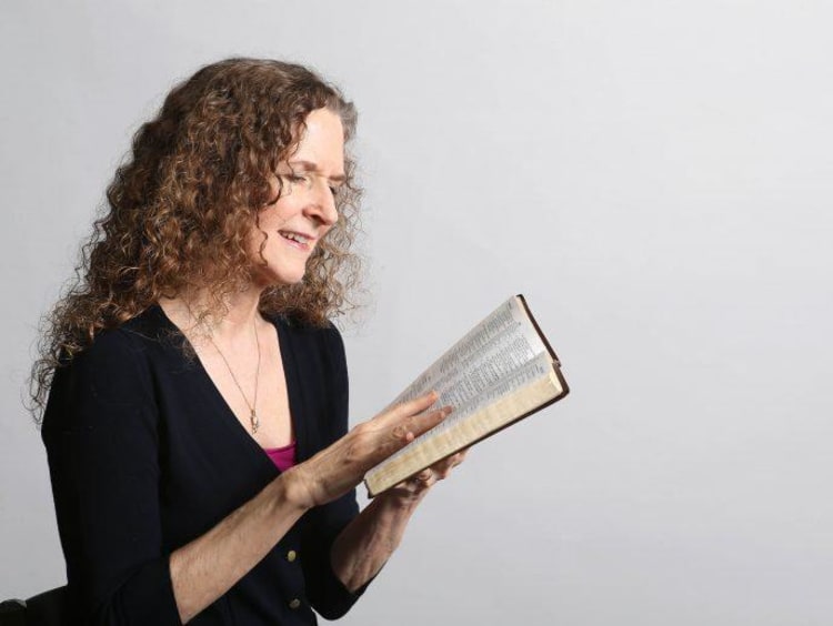 Dr. Smith reads the bible
