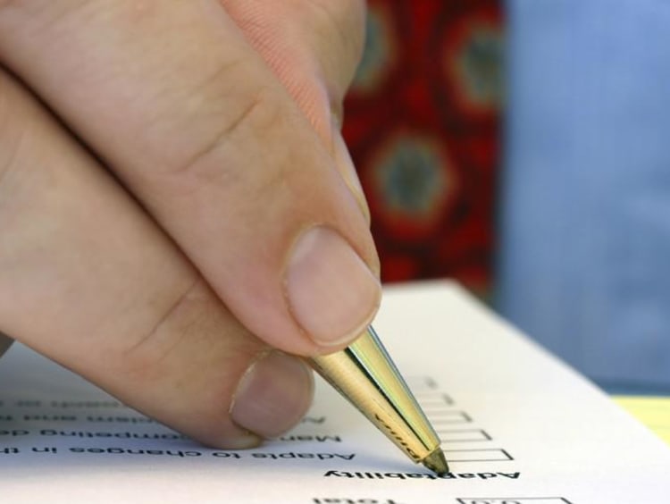 Students writes with pen